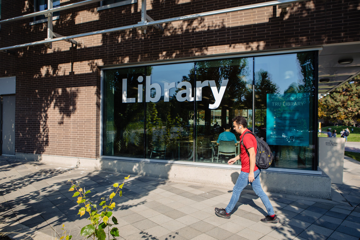 TRU student walking by library
